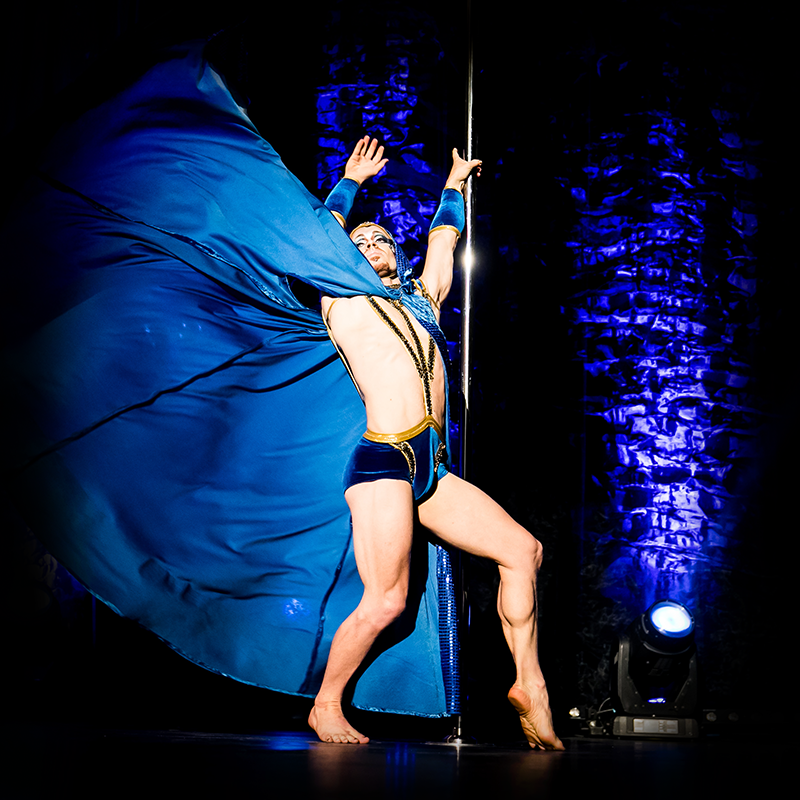 Posing on stage with cape